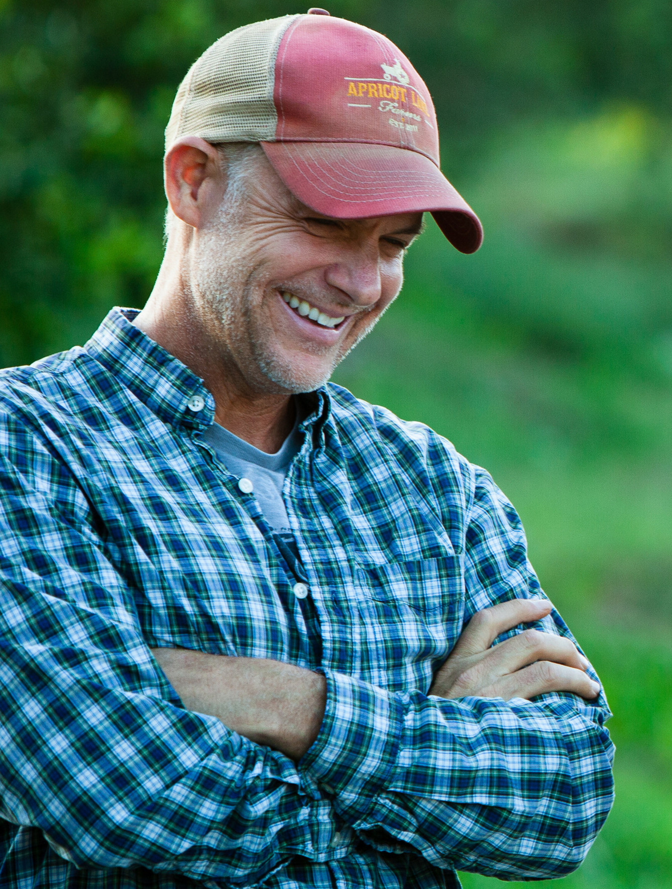 John Chester smiling on the farm